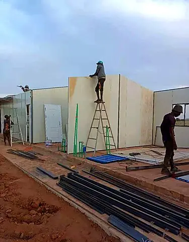 Fixing insulated wall panels